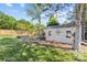 Landscaped backyard with a shed, swing set, and well-maintained lawn for outdoor enjoyment at 3831 Robeson Creek Dr, Charlotte, NC 28270