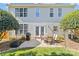 Outdoor patio featuring a grill, dining table, seating, and backyard views with mature trees and greenery at 3831 Robeson Creek Dr, Charlotte, NC 28270