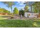 Landscaped backyard with a shed, swing set, and well-maintained lawn for outdoor enjoyment at 3831 Robeson Creek Dr, Charlotte, NC 28270