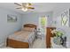 Comfortable bedroom boasts a ceiling fan, neutral paint, and natural light coming through the window at 3831 Robeson Creek Dr, Charlotte, NC 28270