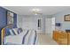 Comfortable bedroom boasts a ceiling fan, a blue accent wall, and natural light coming through the windows at 3831 Robeson Creek Dr, Charlotte, NC 28270