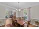 Elegant dining room with hardwood floors, chandelier, and large windows, perfect for Gathering gatherings at 3831 Robeson Creek Dr, Charlotte, NC 28270
