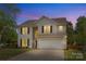 Charming two-story home with a well-manicured lawn and attached two-car garage at 3831 Robeson Creek Dr, Charlotte, NC 28270