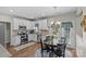 Bright kitchen with stainless steel appliances, granite countertops, and eat-in area with backyard access at 3831 Robeson Creek Dr, Charlotte, NC 28270