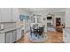 Cozy eat-in kitchen area with a round table, stainless appliances, and view of the living room fireplace at 3831 Robeson Creek Dr, Charlotte, NC 28270