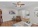 Relaxing living room with hardwood floors, comfortable recliner, and view into the kitchen at 3831 Robeson Creek Dr, Charlotte, NC 28270
