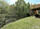 Backyard featuring a wooden fence, trees, and the back of the house with a deck at 3914 Cassidy Dr, Waxhaw, NC 28173