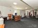Spacious finished basement used as a home gym with workout equipment and a desk area at 3914 Cassidy Dr, Waxhaw, NC 28173