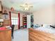 Comfortable bedroom featuring a wooden bed frame, ceiling fan, and organized closet at 3914 Cassidy Dr, Waxhaw, NC 28173
