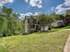 Charming two-story home with stone accents, a covered porch, and a well-manicured lawn at 3914 Cassidy Dr, Waxhaw, NC 28173