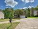 Front exterior of a brick home with a two-car garage, lawn, and clear blue skies at 3914 Cassidy Dr, Waxhaw, NC 28173
