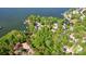 Overhead view of the houses on a peninsula surrounded by water and thick trees at 4036 Windward Dr, Tega Cay, SC 29708