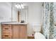 Bathroom with granite countertop, tile floor, and shower with floral shower curtain at 4036 Windward Dr, Tega Cay, SC 29708