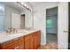 Bright bathroom with a modern double-sink vanity and ample lighting at 4036 Windward Dr, Tega Cay, SC 29708