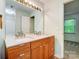 Modern bathroom with a double-sink vanity, bright lighting, and neutral color palette at 4036 Windward Dr, Tega Cay, SC 29708
