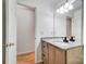 Bathroom with granite countertop and vanity. Features a walk in closet at 4036 Windward Dr, Tega Cay, SC 29708