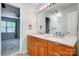 Well-lit bathroom featuring a double vanity and view into another room at 4036 Windward Dr, Tega Cay, SC 29708