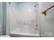 Bathroom shower and tub is an easy-to-clean one-piece acrylic unit with new shower head at 4036 Windward Dr, Tega Cay, SC 29708