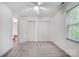 Large bedroom features carpet, a ceiling fan, ample closet space, and natural light at 4036 Windward Dr, Tega Cay, SC 29708