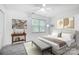 This main bedroom boasts a comfortable bed, neutral decor, and a bright window view at 4036 Windward Dr, Tega Cay, SC 29708