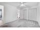 Large bedroom with carpet, a ceiling fan, access to a bathroom, and great closet space at 4036 Windward Dr, Tega Cay, SC 29708