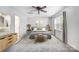 Stylish bedroom featuring neutral colors, a ceiling fan, and ample natural light at 4036 Windward Dr, Tega Cay, SC 29708