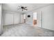 Spacious bedroom with carpet flooring, ceiling fan, bright windows and closets at 4036 Windward Dr, Tega Cay, SC 29708
