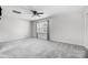 Bright, airy bedroom with carpet flooring, ceiling fan and natural light at 4036 Windward Dr, Tega Cay, SC 29708