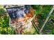 Elevated view of the wooden deck with stairs and railing surrounded by greenery at 4036 Windward Dr, Tega Cay, SC 29708