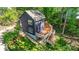 View of the back of the home with a large wooden deck and a lush green lawn at 4036 Windward Dr, Tega Cay, SC 29708