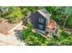 View of the house with a large concrete driveway and a spacious wooden deck at 4036 Windward Dr, Tega Cay, SC 29708