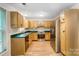 The kitchen features stainless steel appliances and wood cabinetry at 4036 Windward Dr, Tega Cay, SC 29708