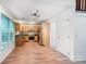 Kitchen with wood cabinets, stainless steel appliances, and wood-look flooring at 4036 Windward Dr, Tega Cay, SC 29708