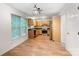 Bright kitchen with stainless appliances, wood cabinets and wood flooring at 4036 Windward Dr, Tega Cay, SC 29708