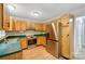 The kitchen features stainless steel appliances and wooden cabinets at 4036 Windward Dr, Tega Cay, SC 29708