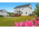 Spacious backyard featuring a wooden deck, well-maintained lawn, and partial black metal fencing for outdoor enjoyment at 4040 Lauren Elizabeth Dr, Rock Hill, SC 29732