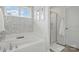 Bathroom featuring a soaking tub, separate glass-enclosed shower, and stylish tile accents at 4040 Lauren Elizabeth Dr, Rock Hill, SC 29732