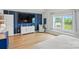 Modern bedroom features a large TV, sleek console, and a comfortable seating area at 4040 Lauren Elizabeth Dr, Rock Hill, SC 29732