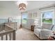 Cozy bedroom with a crib, rocking horse, and neutral decor, perfect for a Bedroom at 4040 Lauren Elizabeth Dr, Rock Hill, SC 29732