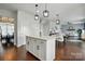 Spacious kitchen with white cabinets, island with bar seating, stainless appliances, and open layout at 4040 Lauren Elizabeth Dr, Rock Hill, SC 29732