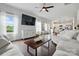 Open concept living room flows to the kitchen with hardwood floors and large windows at 4040 Lauren Elizabeth Dr, Rock Hill, SC 29732
