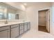 Bathroom featuring double vanity, quartz countertops, a large mirror, and a walk-in shower at 4110 Camden Glen Rd, Lancaster, SC 29720