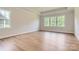 Bright main bedroom featuring large windows, wood floors, and ample natural light at 4110 Camden Glen Rd, Lancaster, SC 29720