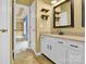 Well-lit bathroom with double sink vanity, tile flooring, and modern fixtures at 4155 Guilford Nw Ct, Concord, NC 28027