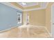 Spacious bedroom with tray ceiling, carpet flooring, and a view of the backyard at 4155 Guilford Nw Ct, Concord, NC 28027