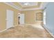 Bright bedroom with tray ceiling, carpet flooring, built-in shelving, and ample natural light at 4155 Guilford Nw Ct, Concord, NC 28027