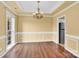 Spacious dining area featuring hardwood floors, elegant lighting, and neutral paint at 4155 Guilford Nw Ct, Concord, NC 28027
