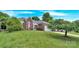 Beautiful brick home with a well-manicured lawn and mature trees at 4155 Guilford Nw Ct, Concord, NC 28027