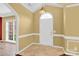 Inviting foyer with tile flooring, complemented by white trim and a chandelier at 4155 Guilford Nw Ct, Concord, NC 28027