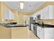 Bright kitchen with white cabinets, granite countertops, and stainless steel appliances at 4155 Guilford Nw Ct, Concord, NC 28027